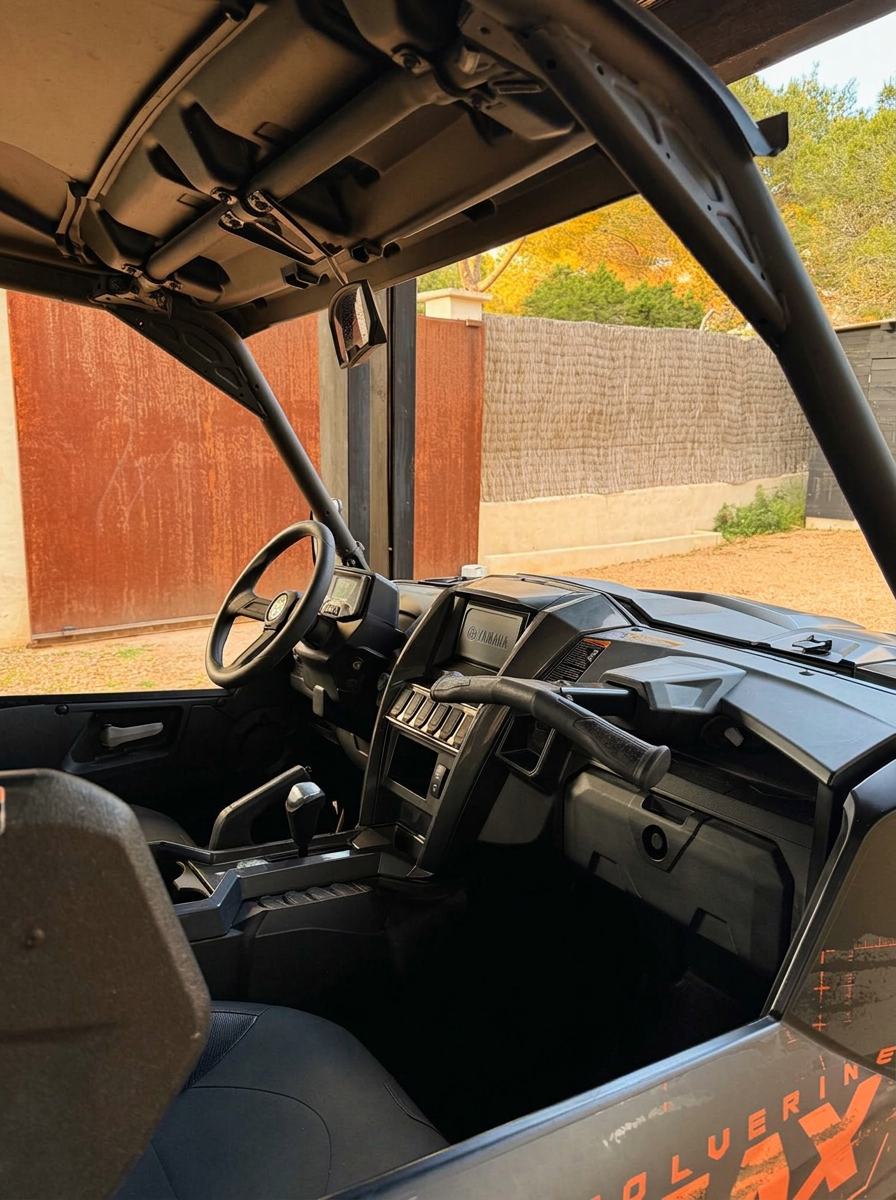 Passenger-side view of the Yamaha buggy cabin with steering wheel, dashboard, seats and gear selector